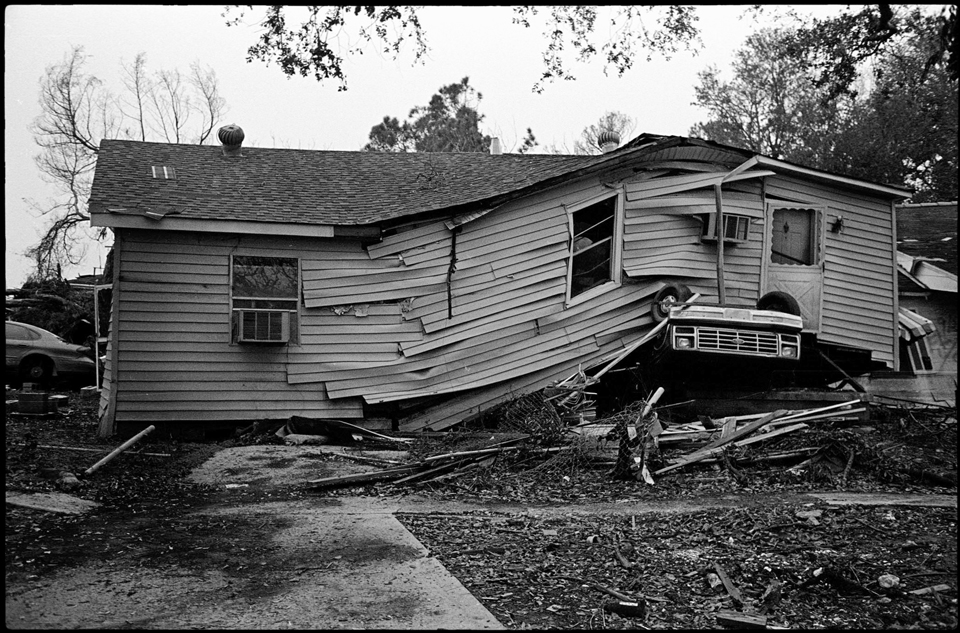 lower 9th ward after hurricane katrina - house on top of car