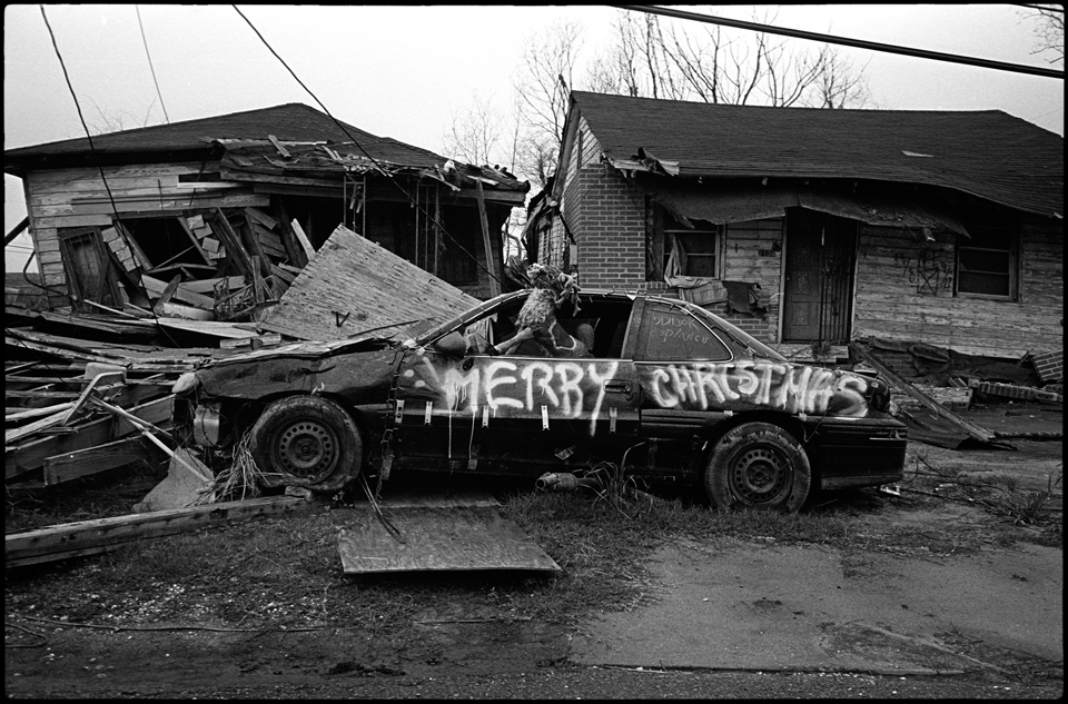 lower 9th ward after hurricane katrina - car with Merry Christmas graffitied on it