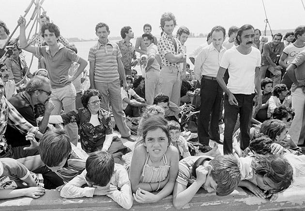 Cuban refugees wait aboard a boat at the port of Mariel, Cuba, bound for Key West, Fla., Saturday, April 23, 1980.  Cuban President Fidel Castro has agreed to let the Cubans leave the Communist island to start a new life in the United States.