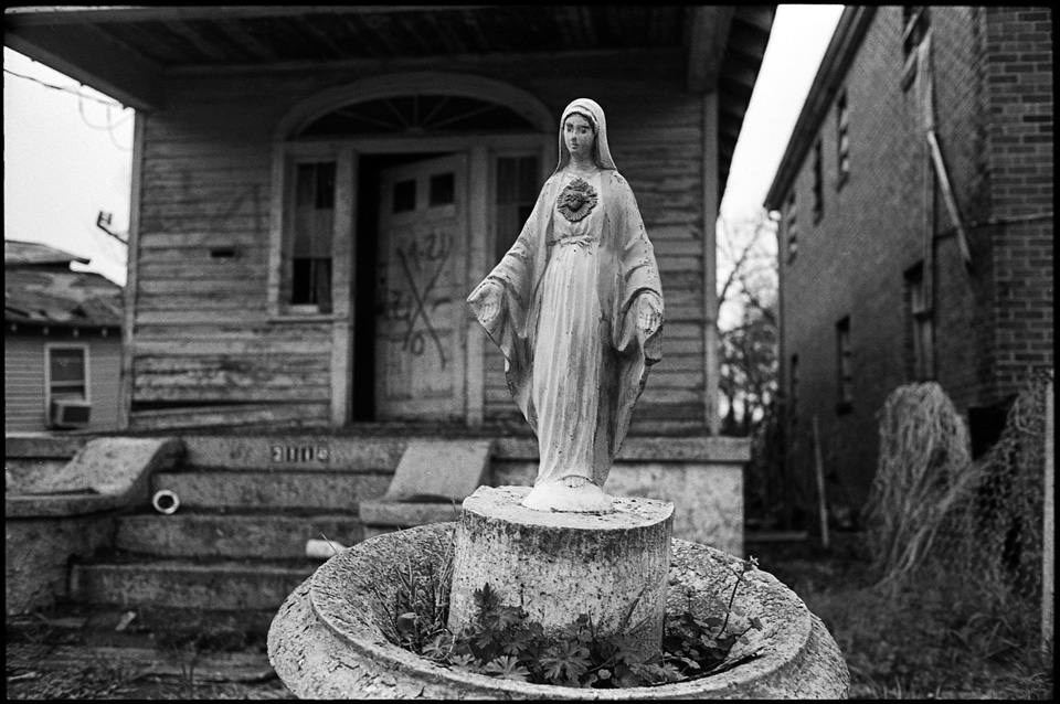 lower 9th ward after hurricane katrina - virgin mary water fountain in front of house