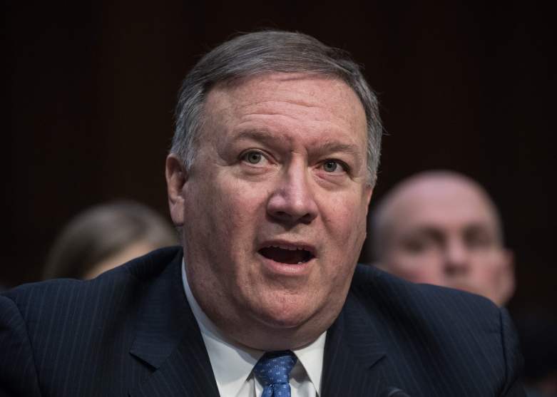 White man with gray hair, wearing suit, mouth slightly agape