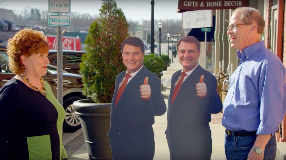 Mike Braun and cardboard cutouts