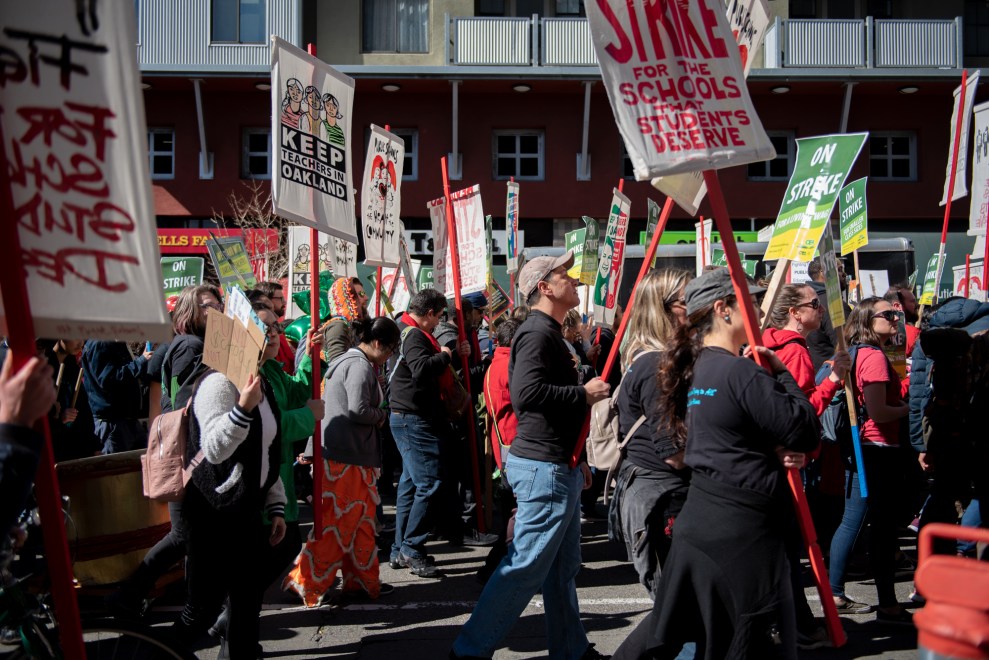 Supporters march to the school district offices on Broadway.