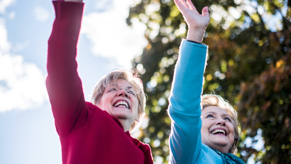 Elizabeth Warren and Hillary Clinton waving