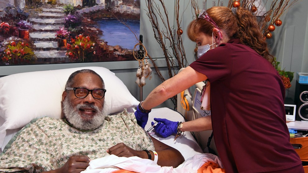 A patient at the Lebanon VA Medical Center receives a COVID-19 vaccine.