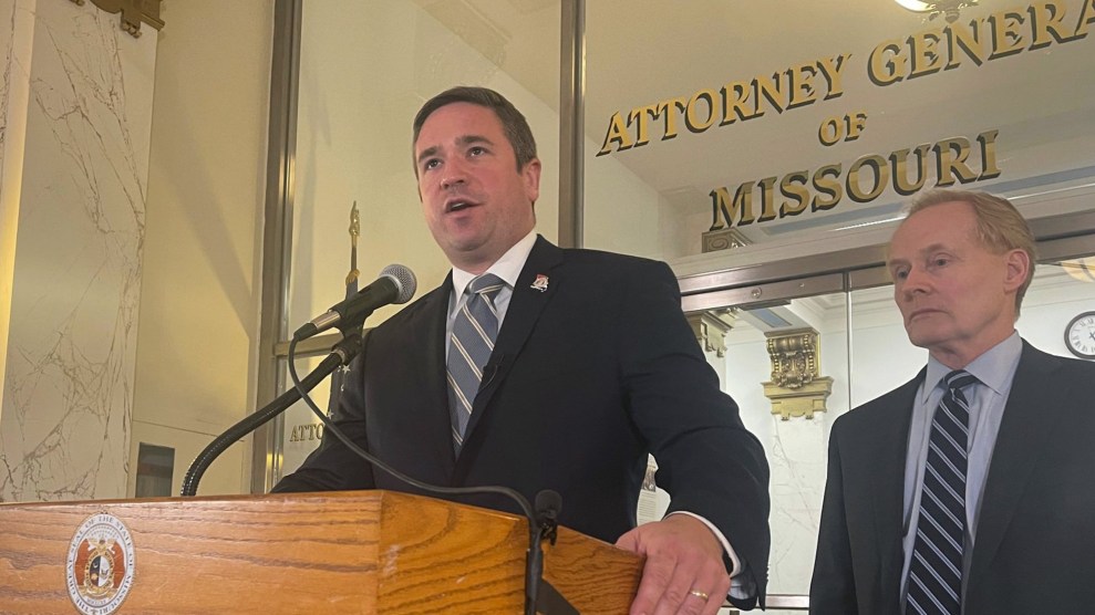 Andrew Bailey stands at a podium in front of an office labeled "Attorney General of Missouri."