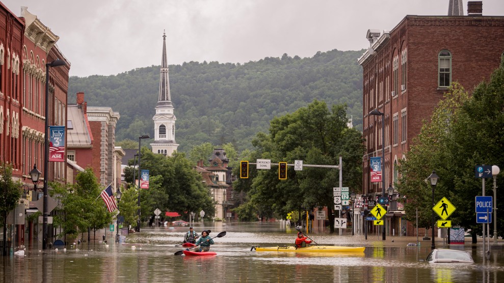 People kayaking through flooding in downtown Montpelier, Vermont