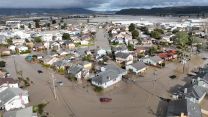 - This aerial photograp shows vehicles and homes engulfed by floodwaters in Pajaro, California on Saturday, March 11, 2023.
