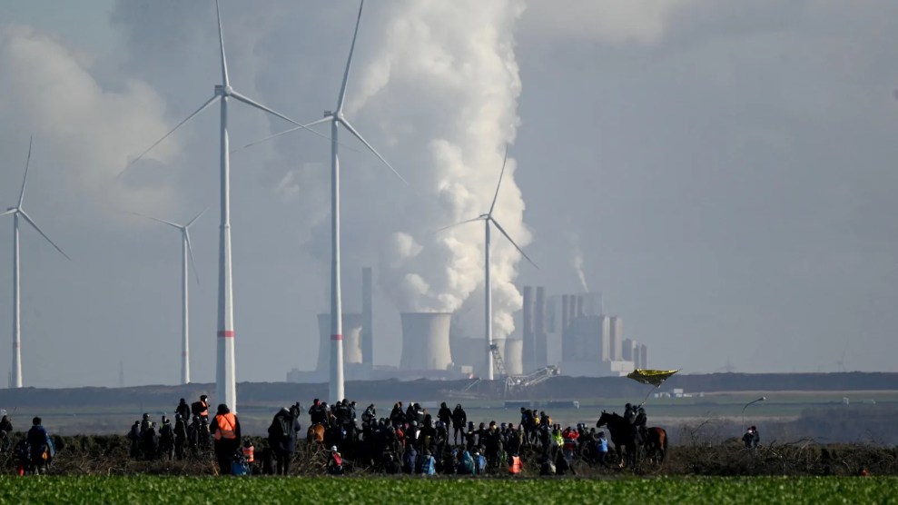 People at a protest in front of a factory