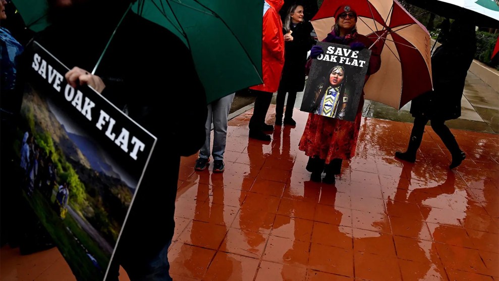 Protestors with signs that say "Save Oak Flat"