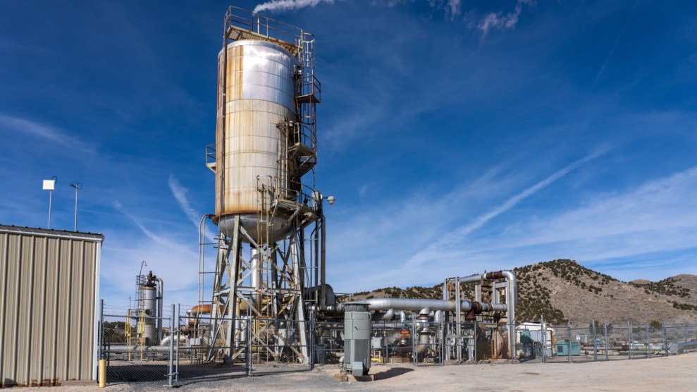 A large white silo sits on top of metal tubing.