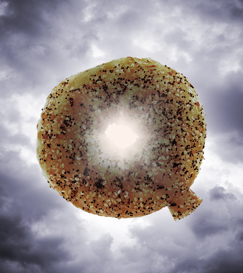 An illustration of an everything bagel, shaped like the letter Q, surrounded by gray clouds.