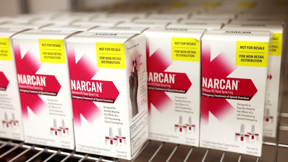 A supply of Narcan, in individual boxes, on a shelf.