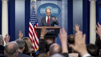 vought pointing at a crowd of reporters in the white house briefing room