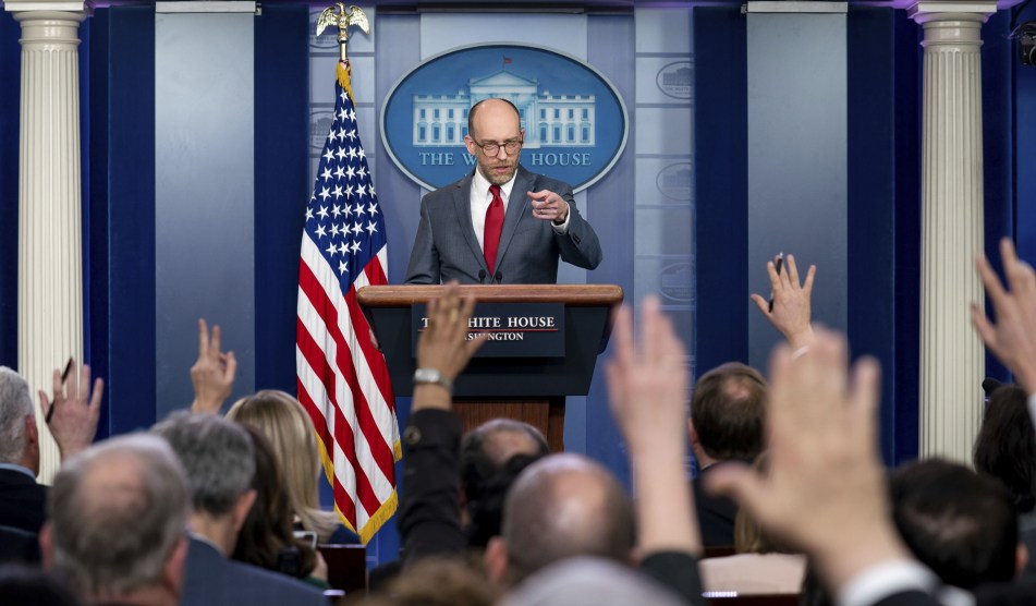 vought pointing at a crowd of reporters in the white house briefing room