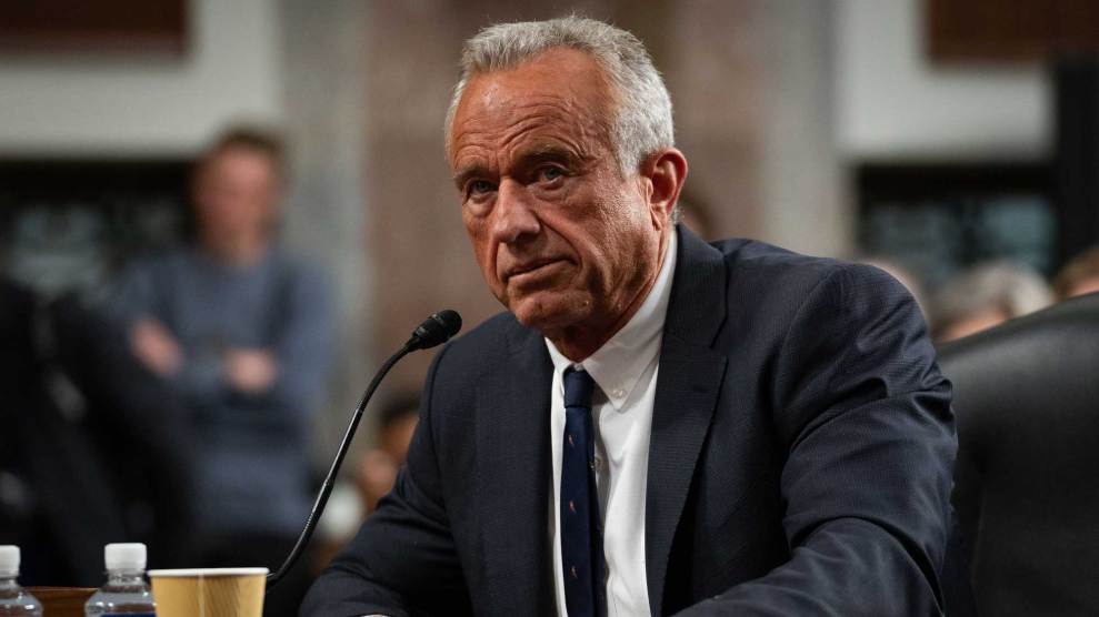 Robert F. Kennedy Jr., in a dark suit, speaking into a microphone