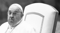 A black-and-white photo of Pope Francis seated in a high-backed chair.