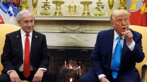 Israeli Prime Minister Benjamin Netanyahu and US President Donald Trump sit in front of a fireplace at the White House.