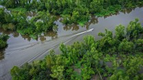 A boat makes its way along the Atchafalaya River in the Atchafalaya Basin