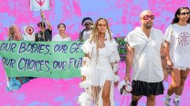 Activists for trans-rights march in Washington, carrying signs and banners.