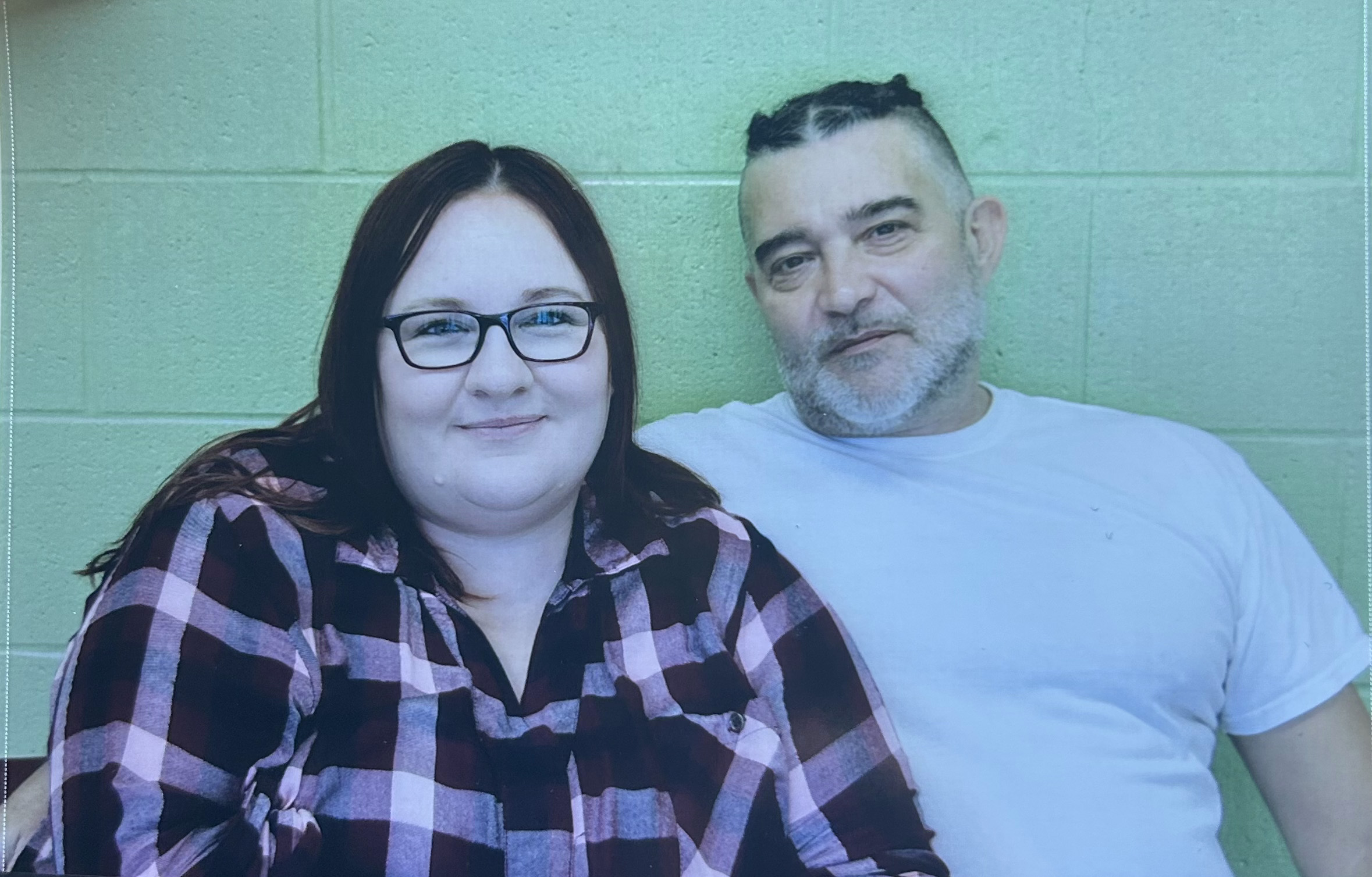 Man and woman sitting together.