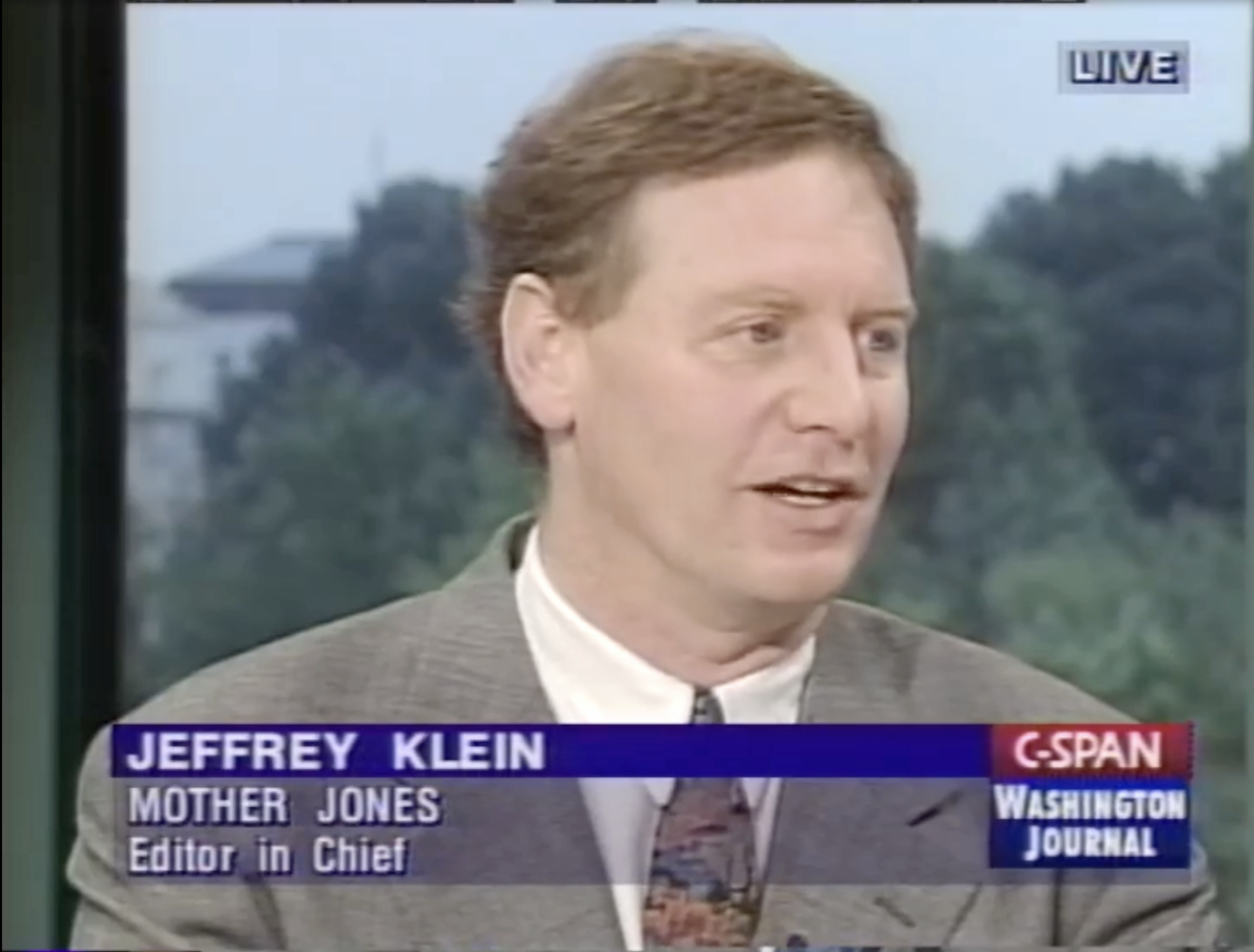 Screen grab of Jeffrey Klein as a middle-aged man, wearing a suit and speaking to a host on C-SPAN.