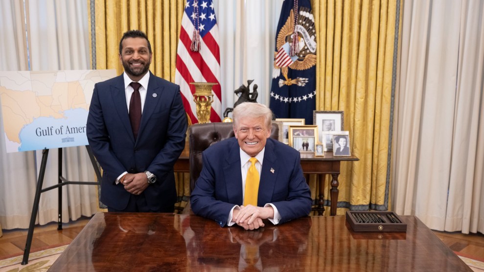 U.S President Donald Trump sitting to the right with the new FBI Director Kash Patel standing on the left at the Oval Office of the White House.