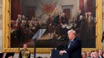 Donald Trump speaks in front of a painting of the Founding Fathers