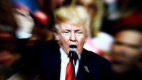 A slow shutter speed image of Donald Trump yelling and pointing on a TV screen