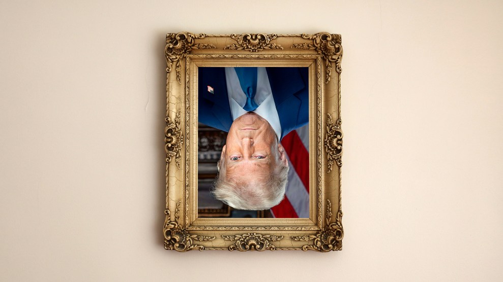 A framed portrait of Donald Trump hanging upside down on a beige wall.