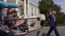 Trump walking past journalists at White House