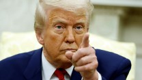 Donald Trump points at camera