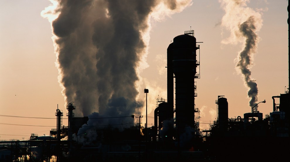 Industrial plant silhouette aginst a gray sky