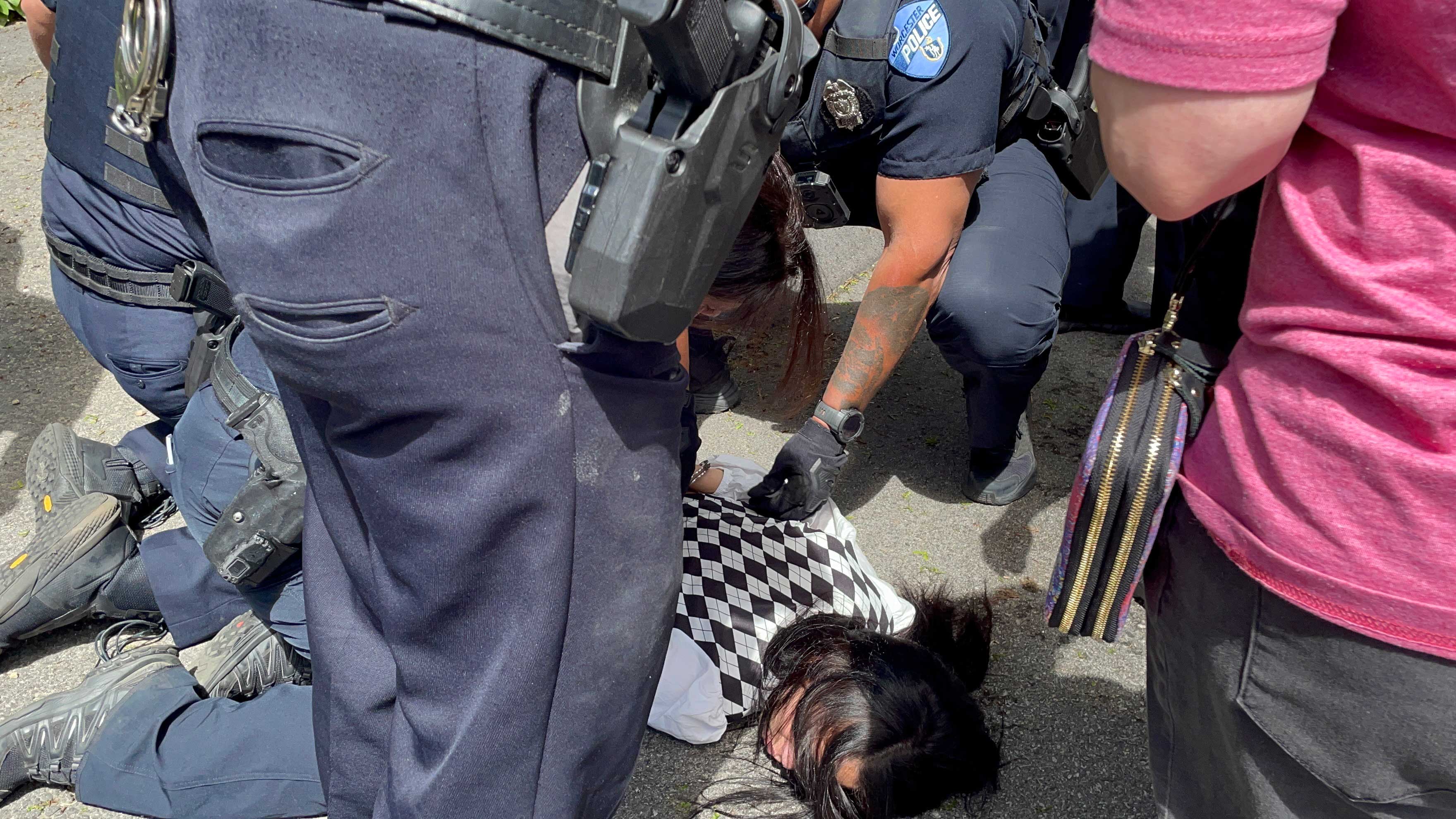 The daughter of the deportee, a 16-year-old minor whose name has not been disclosed, held to the ground and cuffed by Worcester police officers.