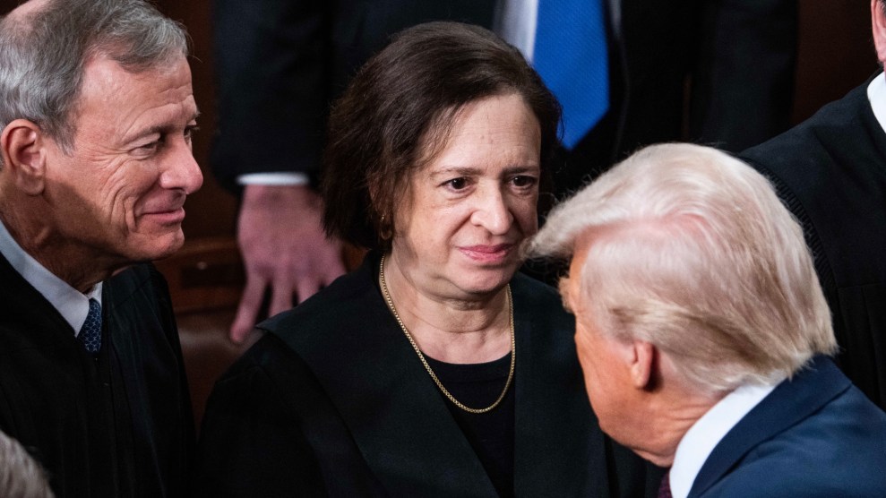 John Roberts and Elena Kagan make eye contact with President Trump as he walks past them after his March 2025 address to Congress. The justices are wearing black robes, the president is in a blue suit.