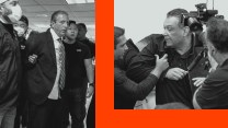 A man in a suit is being detained by federal agents on the left, while another man in a black jacket is being restrained by agents on the right.