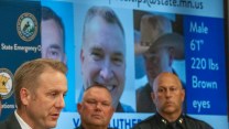 law enforcement officers in front of an image and description of Minnesota shooting suspect