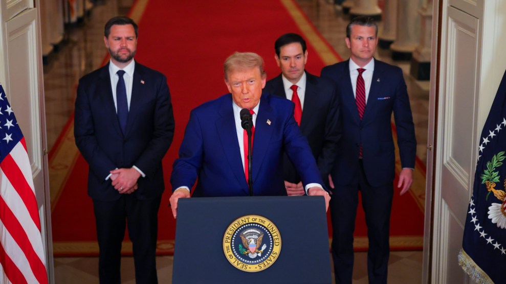 President Trump stands at a podium at the White House next to other top officials, including Vice President JD Vance.