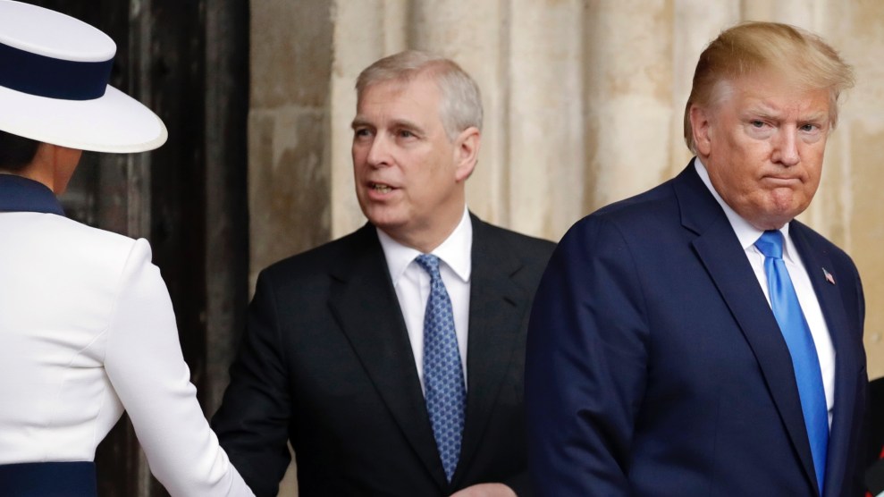 Melania Trump and her large white hat can be seen from behind as she shakes hands with England's Prince Andrew. President Trump is also in the photo, displaying an unhappy facial expression.