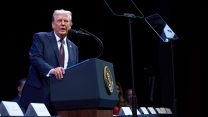 Trump speaking into a microphone at the presidential podium.