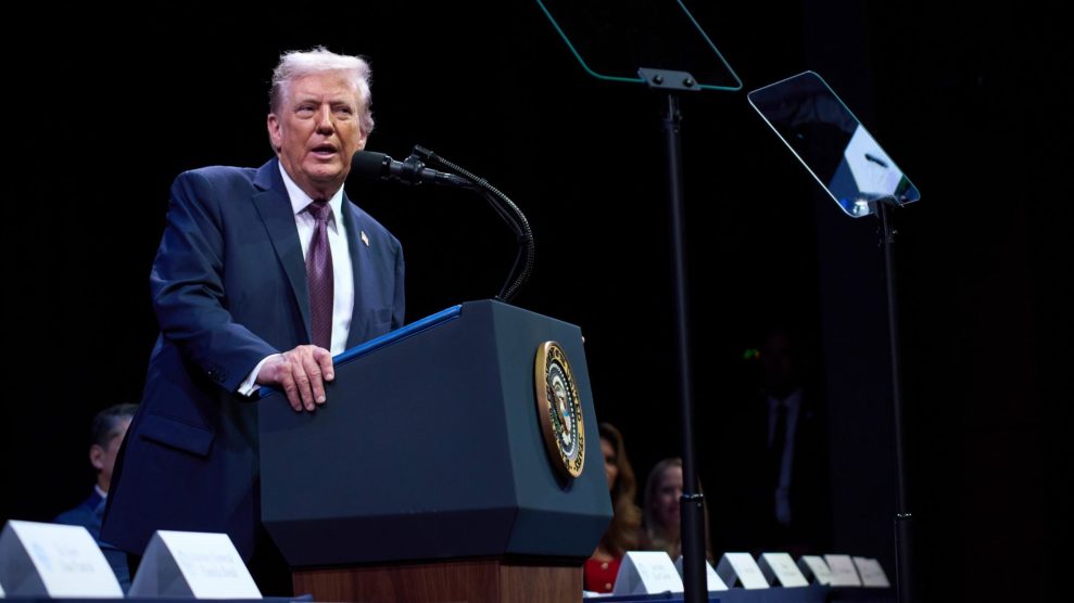 Trump speaking into a microphone at the presidential podium.