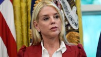 Attorney General Pam Bondi listens as President Donald Trump signs a presidential memorandum