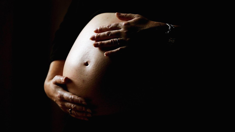 A zoomed-in image of a visibly pregnant stomach.
