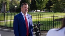 Bill Pulte stands behind a microphone in the White House driveway.