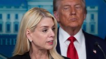 Trump lookin at Pam Bondi from the briefing room.