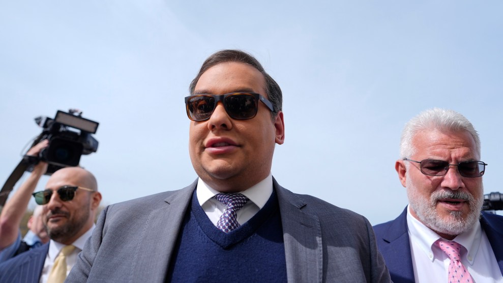 George Santos in a blue sweater and suit jacket.