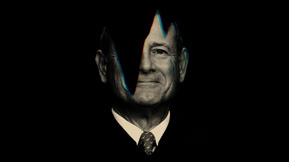 A black-and-white portrait of Chief Justice John Roberts, with the left side of his face obscured by darkness.