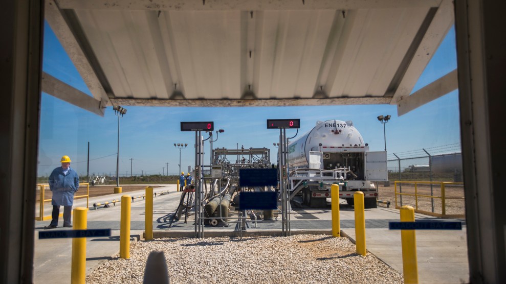 A view from a loading dock of a tanker being filled.