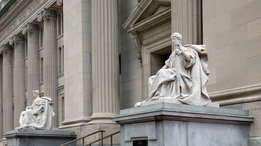 A marble building with statues