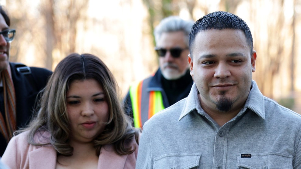 Kilmar Abrego Garcia arrives at a courthouse flanked by media.